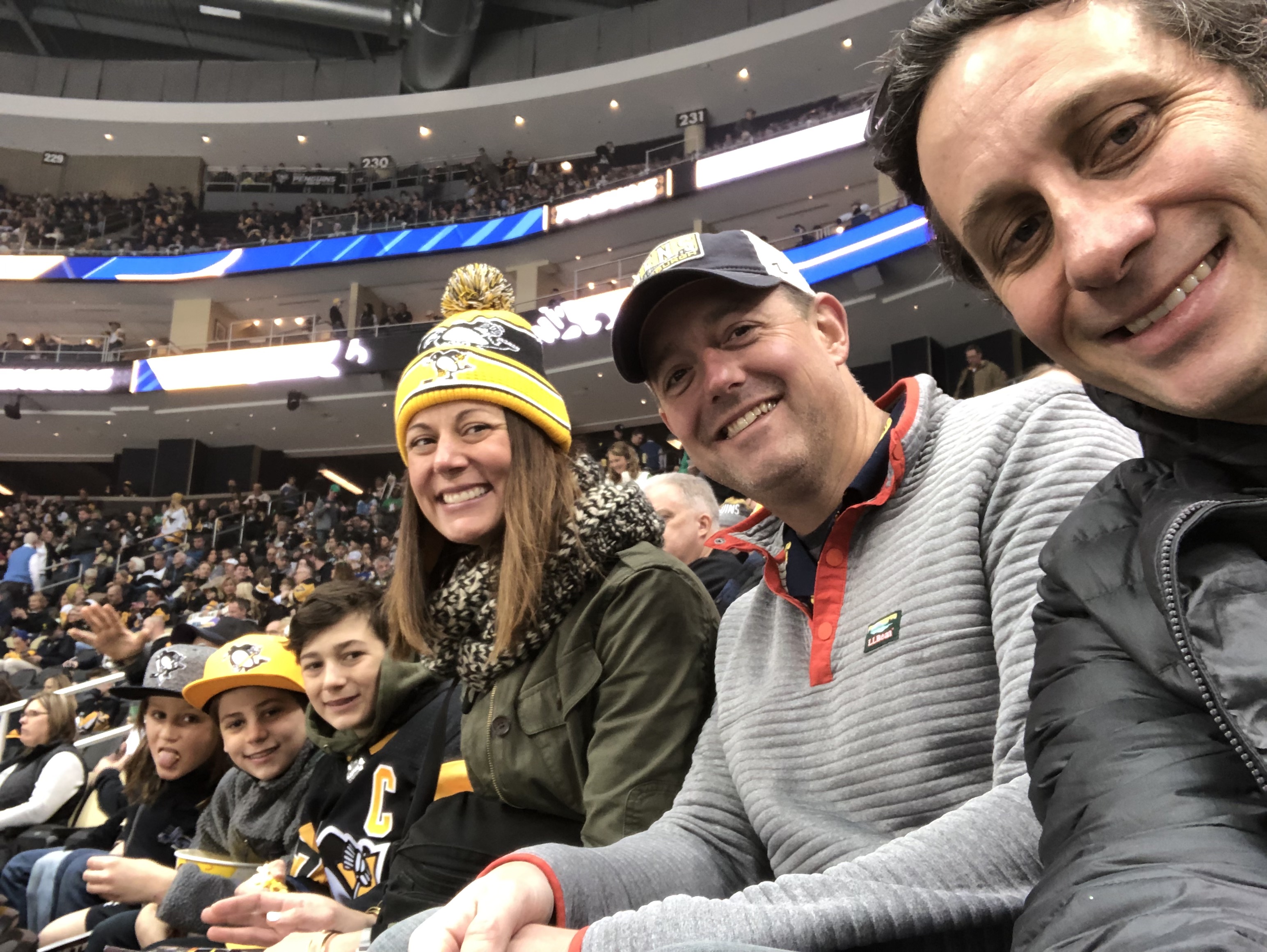 My wife and her brother at our first Penguins game